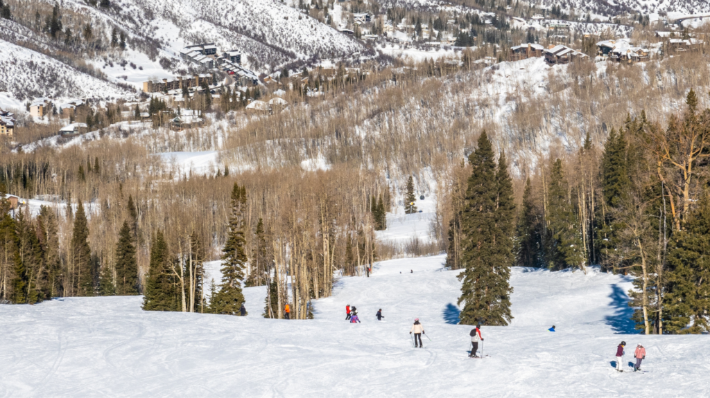 Snow skiers on mountains of Wood Run community outside Aspen Colorado